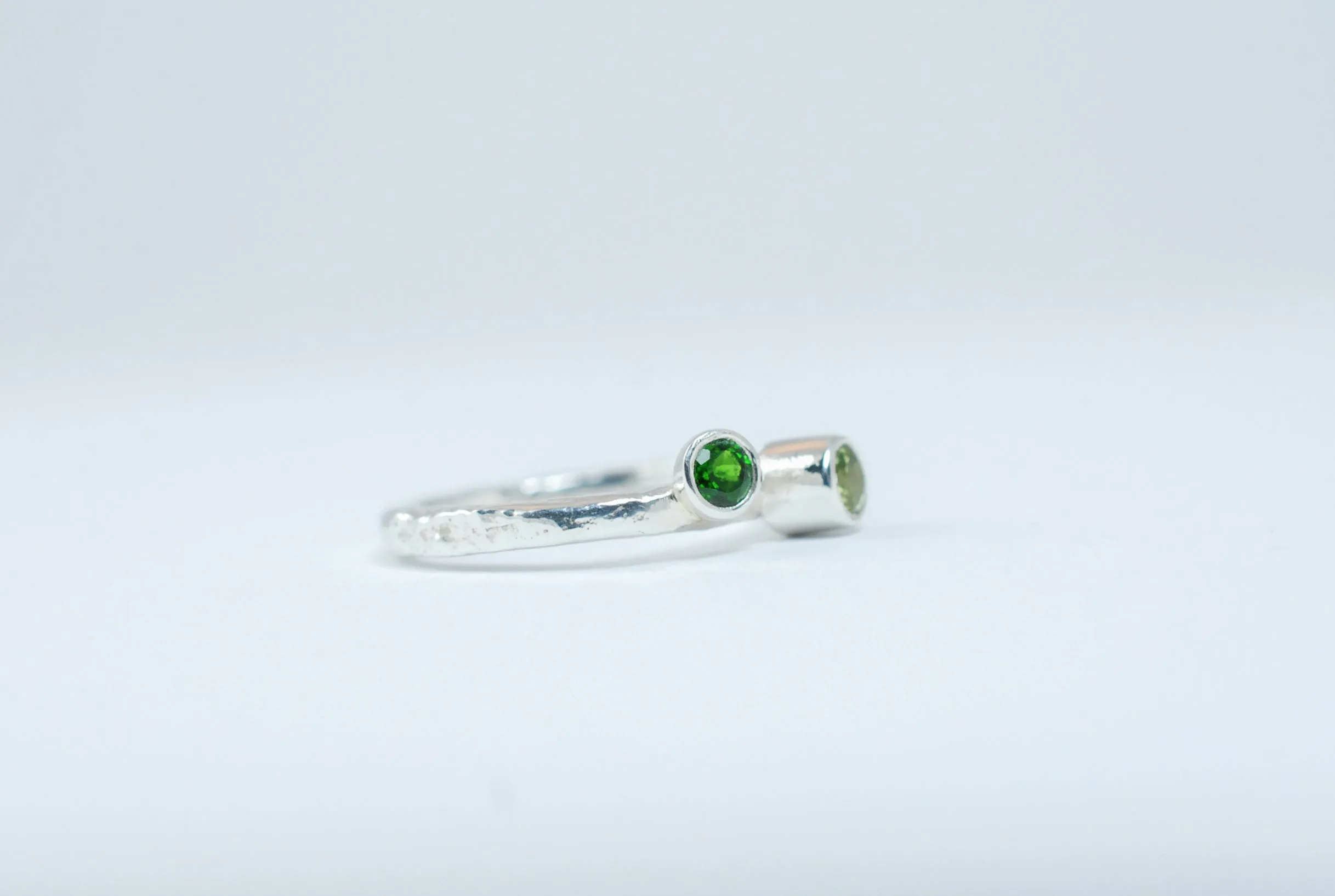 Silver two green stone stackable ring